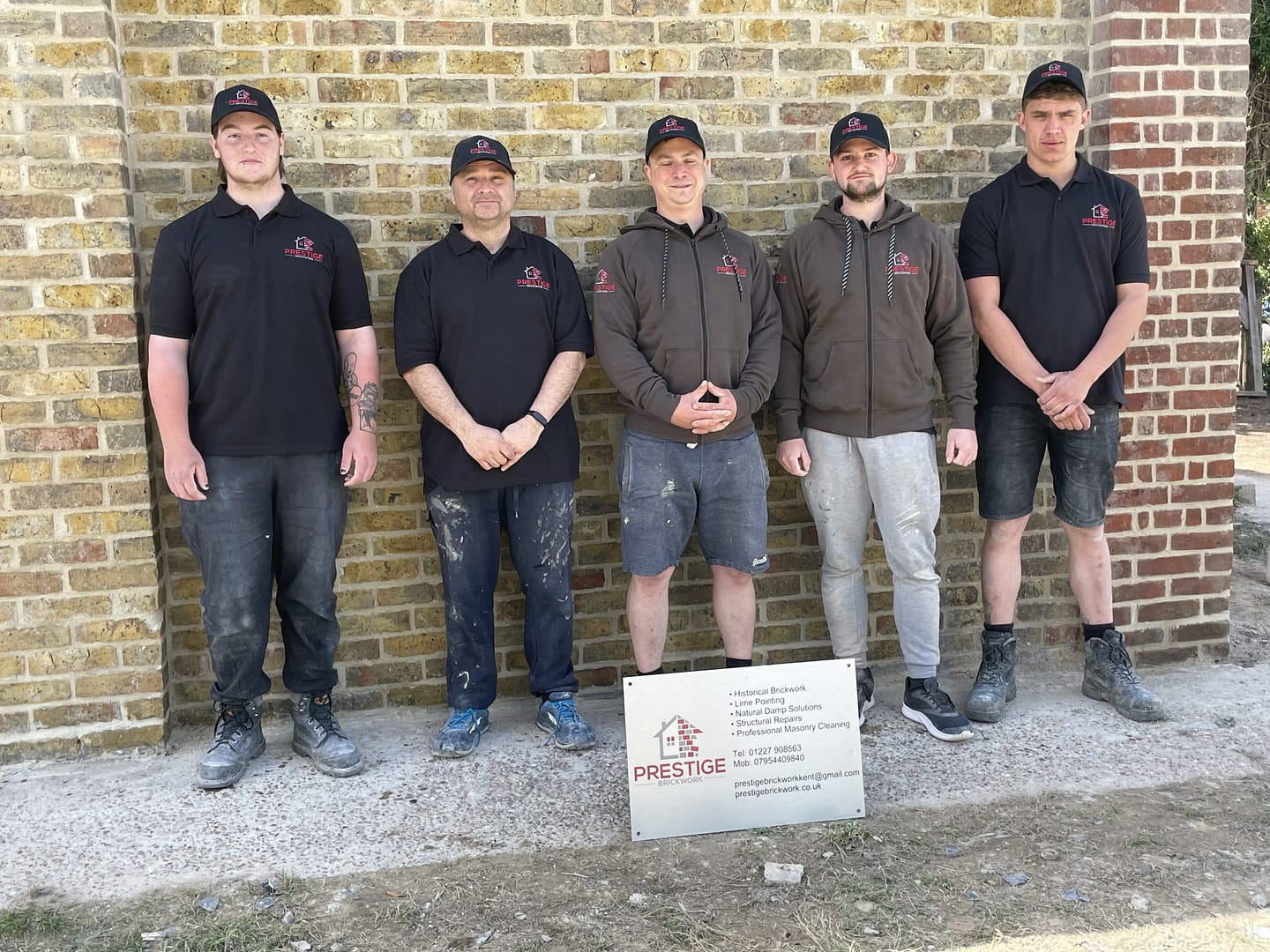 Team photo but the boss is asleep standing up