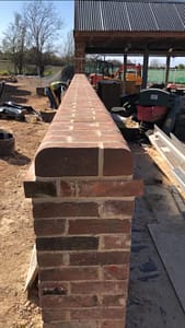 Wall with rounded brick on edge