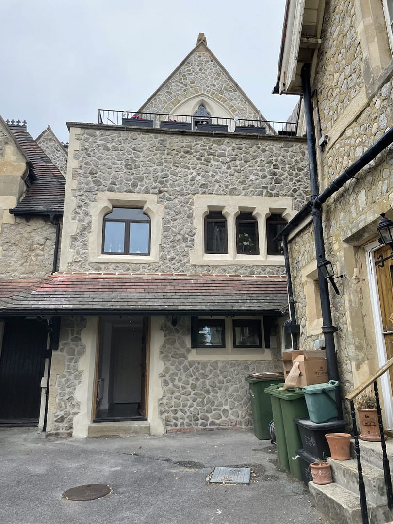 Complete front of rag stone terraced hosue in Folkestone, repointed with lime and seashell